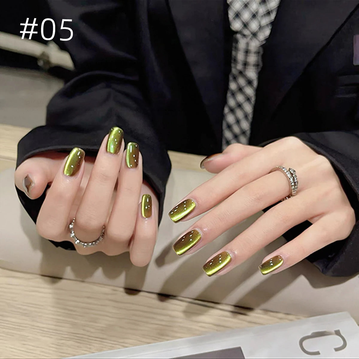 Numbered chrome nail shade shown on hands