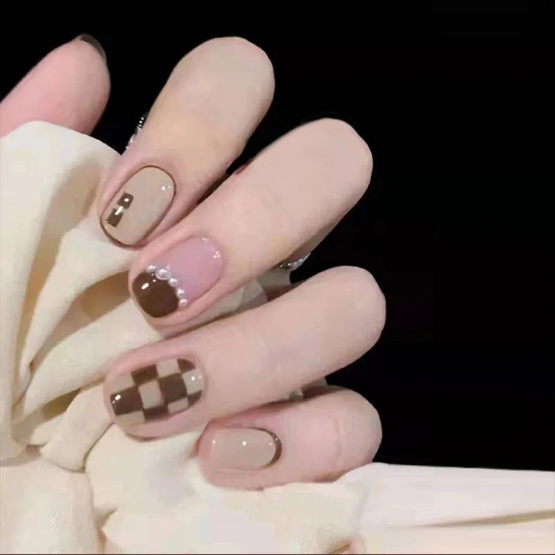 Decorated nail designs shown on hands