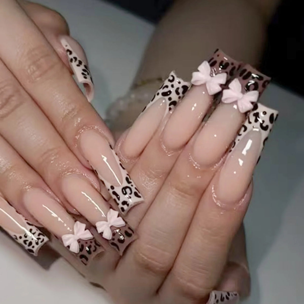 Decorated nail designs shown on hands