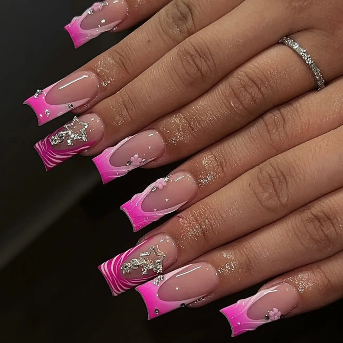 Decorated nail designs shown on hands