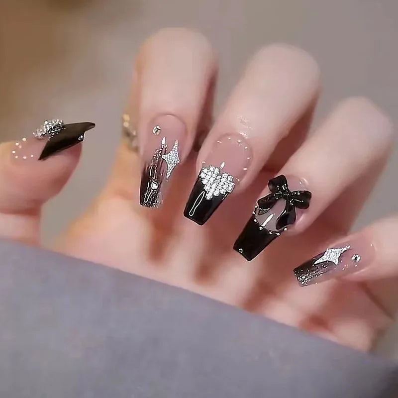 Decorated nail designs shown on hands