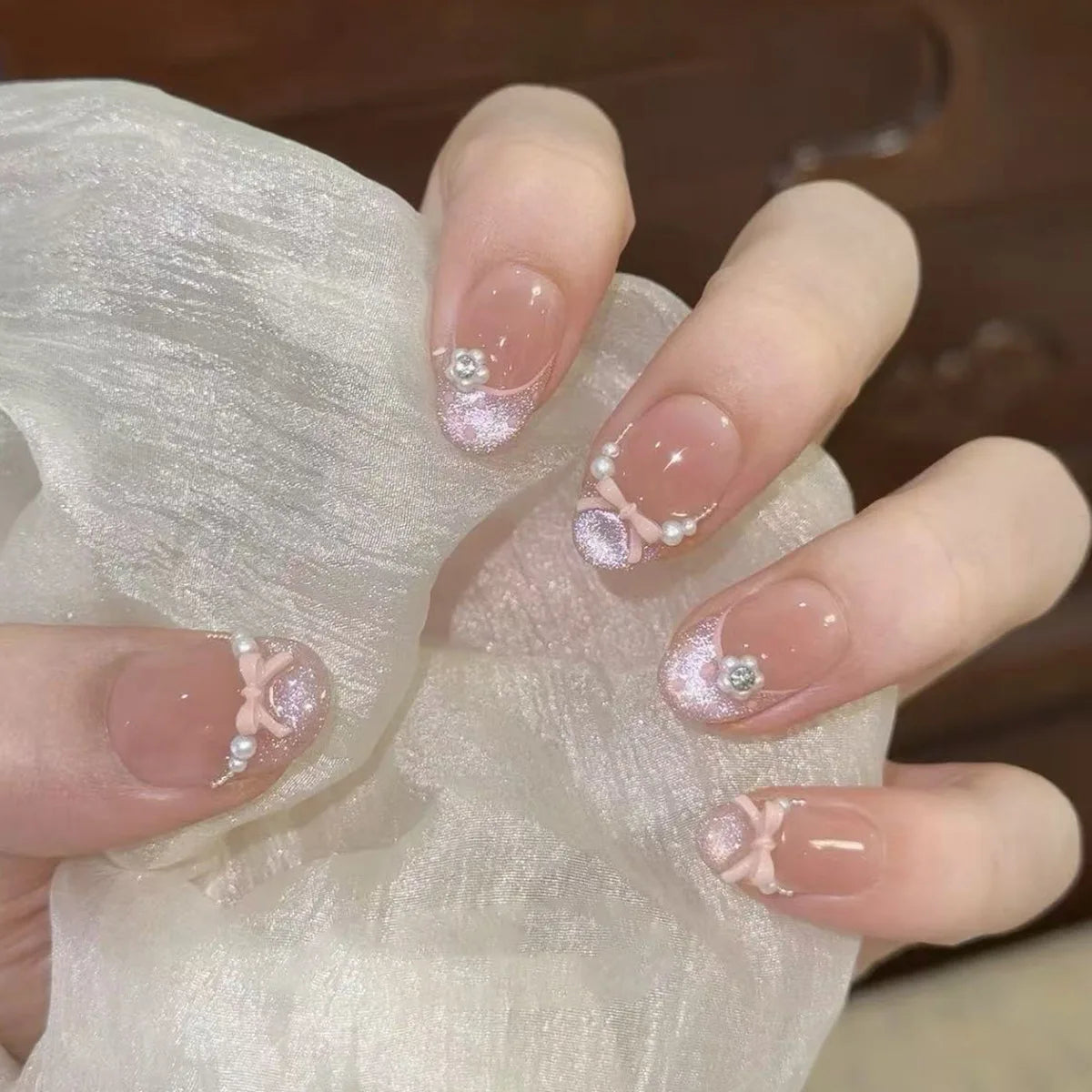 Decorated nail designs shown on hands