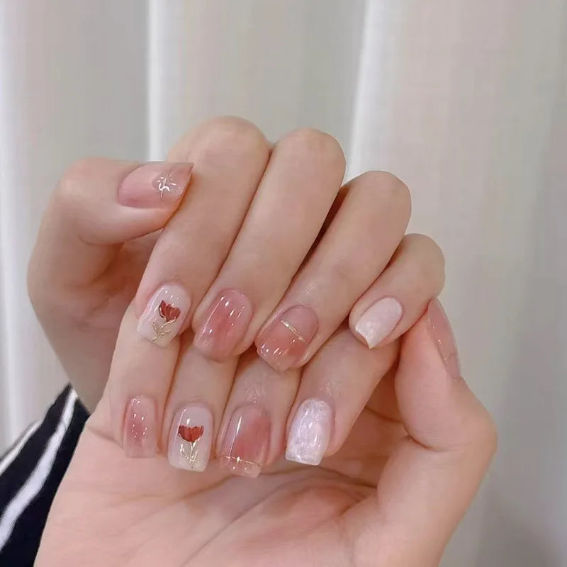 Decorated nail designs shown on hands