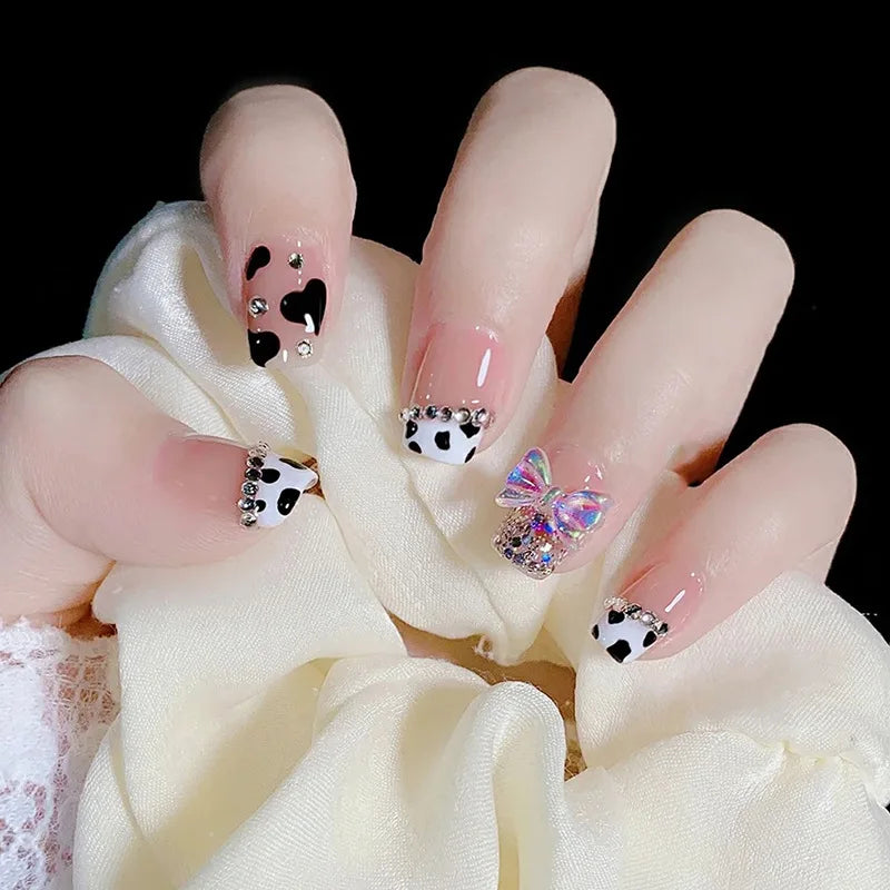 Decorated nail designs shown on hands