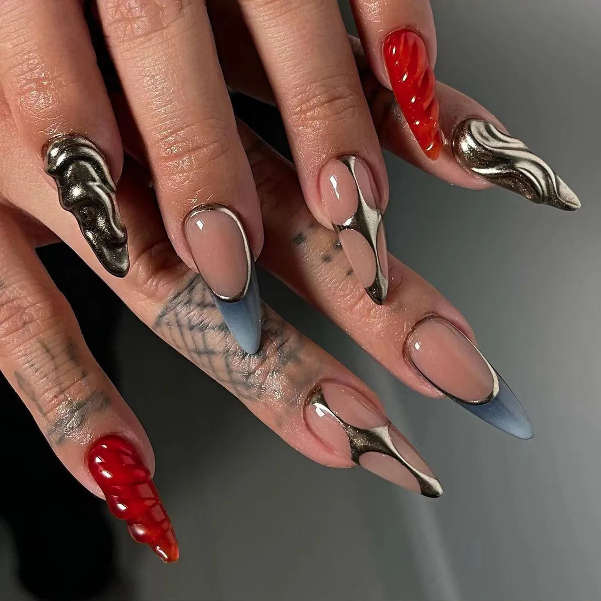 Long decorative nail designs with raised accents shown on hands