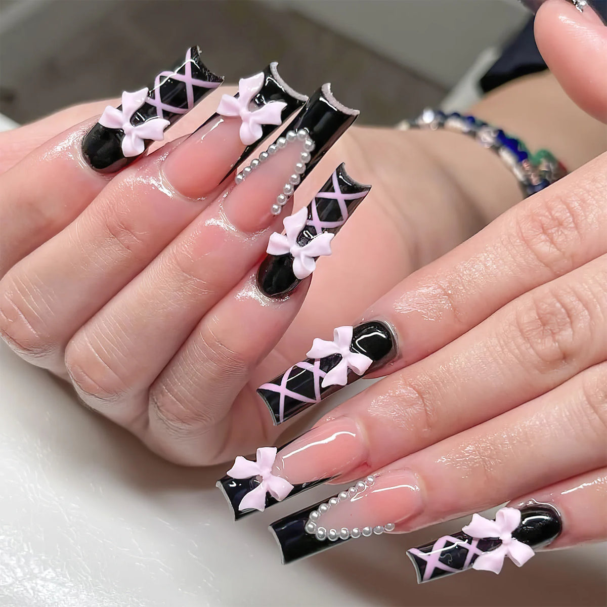 Decorated nail designs shown on hands