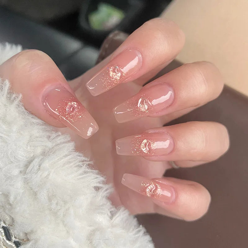 Decorated nail designs shown on hands