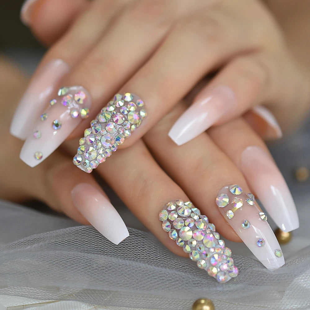 Rhinestone-decorated nail designs shown on hands