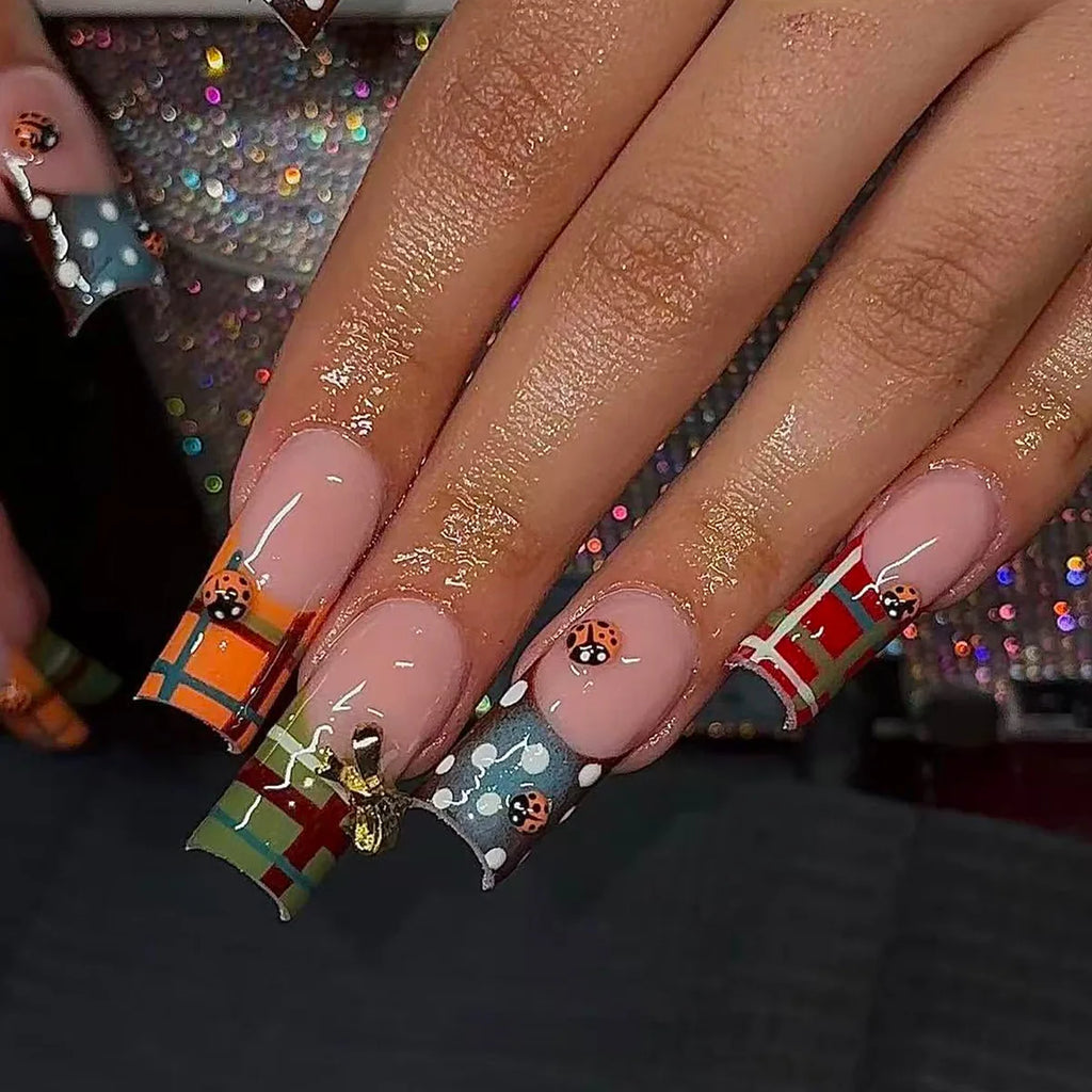 Decorated nail designs shown on hands