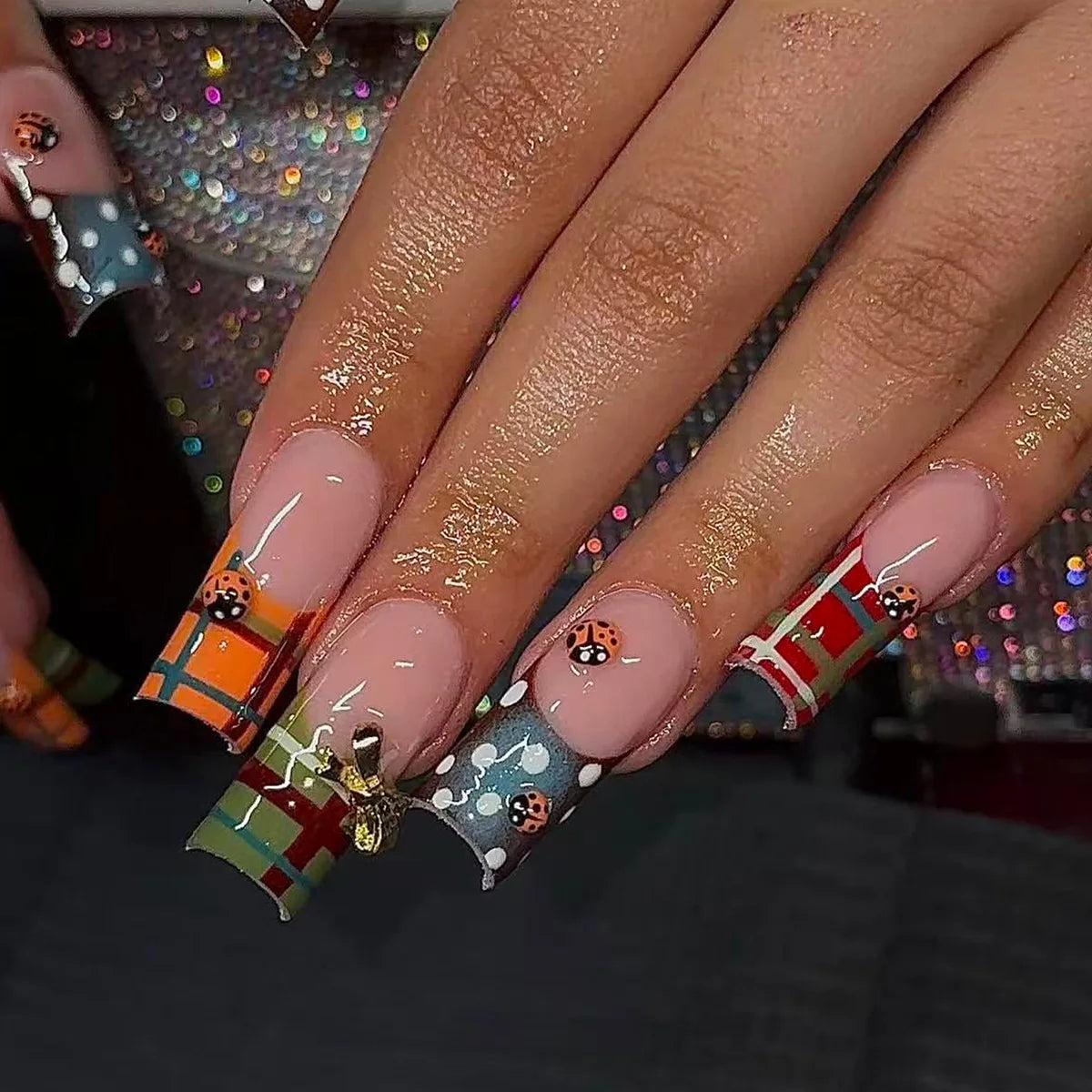 Decorated nail designs shown on hands