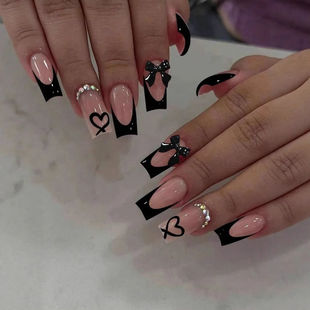 Decorated nail designs shown on hands
