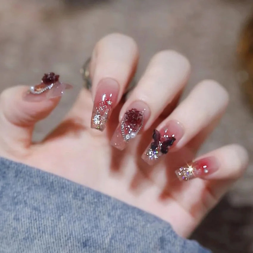 Decorated nail designs shown on hands