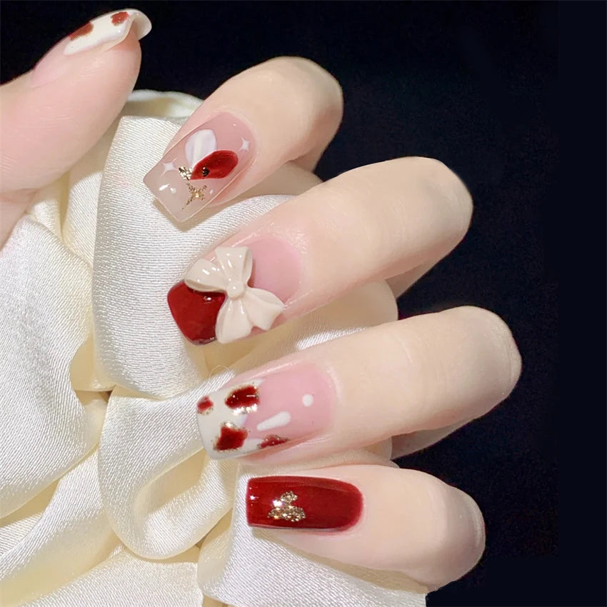 Decorated nail designs shown on hands