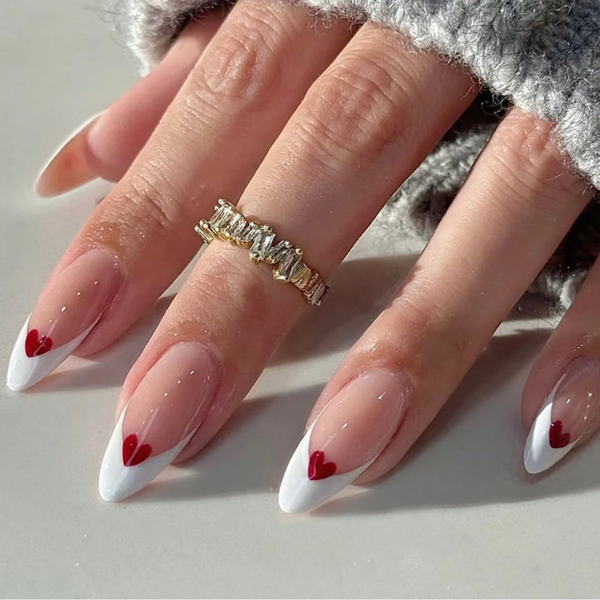 Decorated nail designs shown on hands