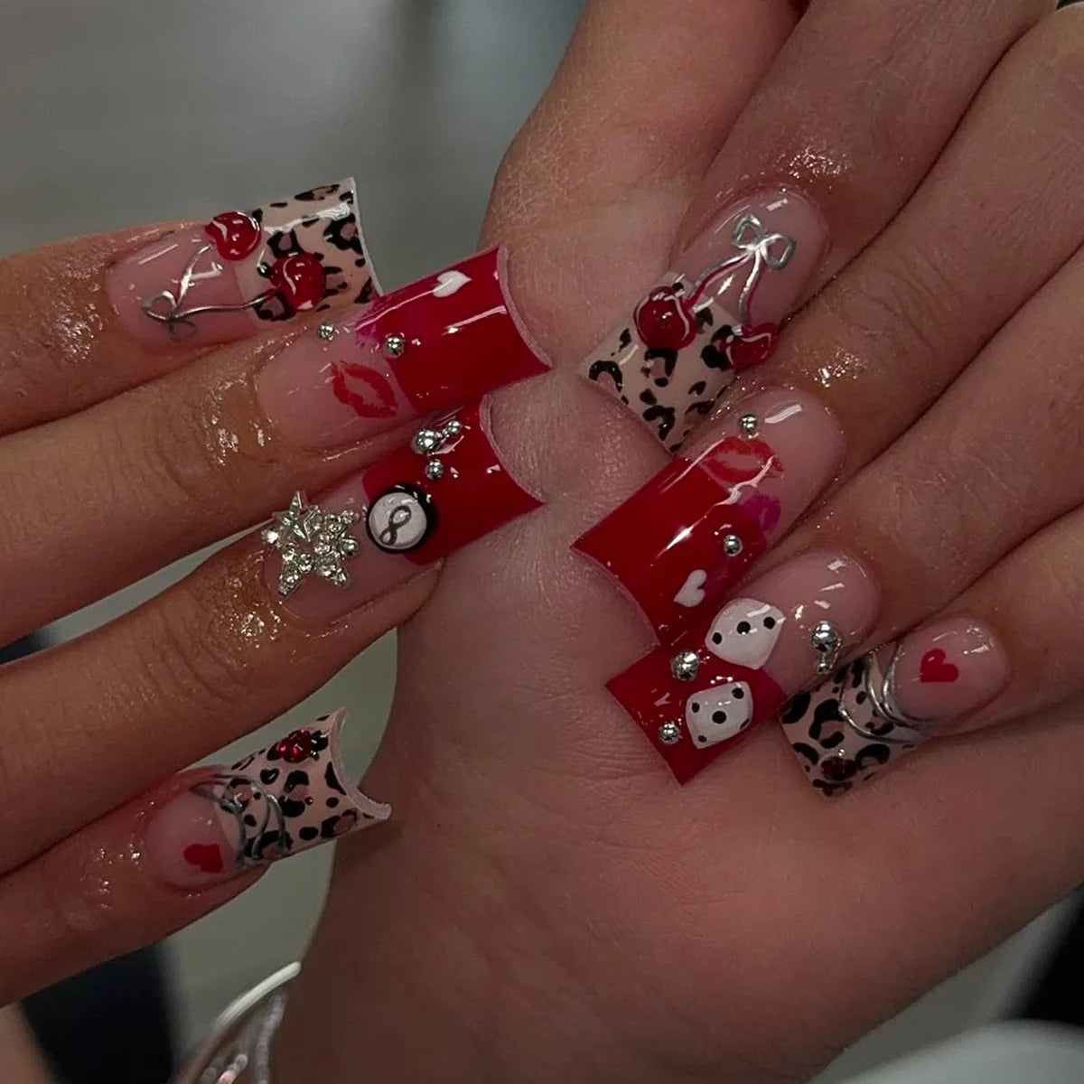 Decorated nail designs shown on hands