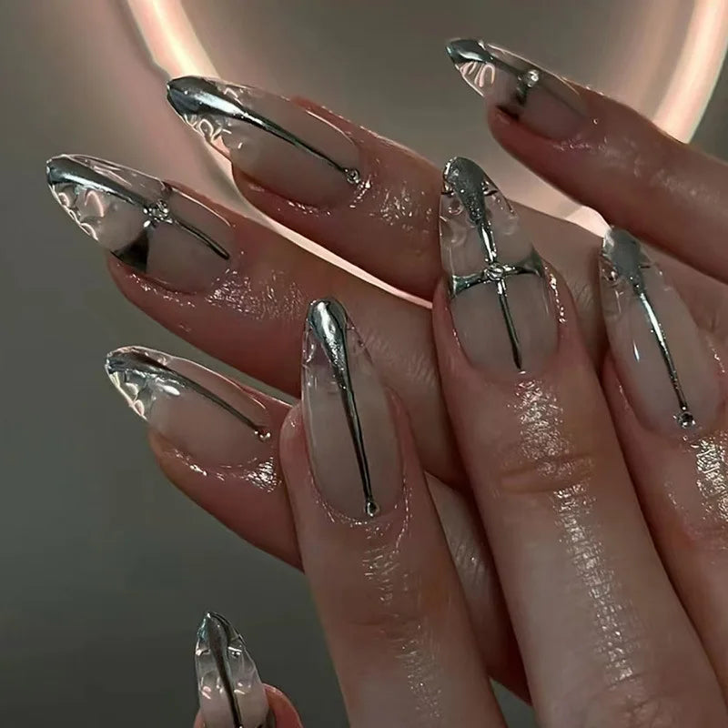 Metallic and decorated nail designs shown on hands