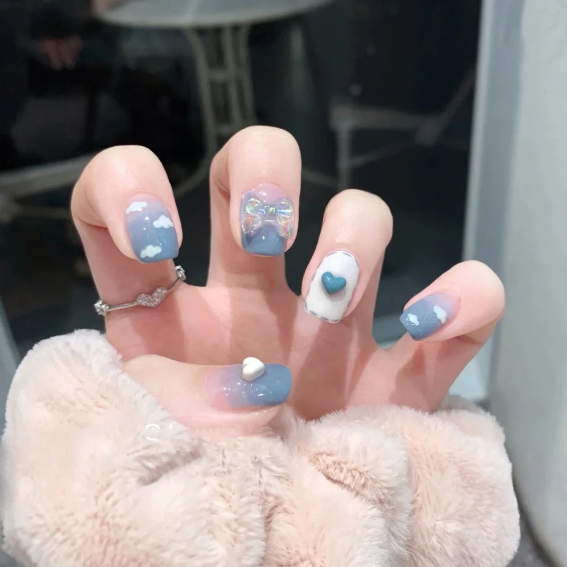 Decorated nail designs shown on hands