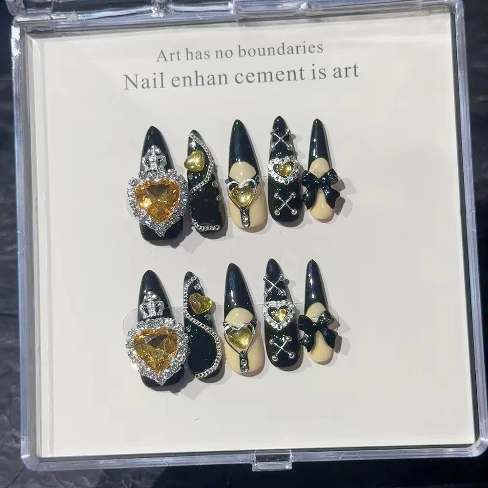 Decorated press-on nail sets with raised embellishments on display cards