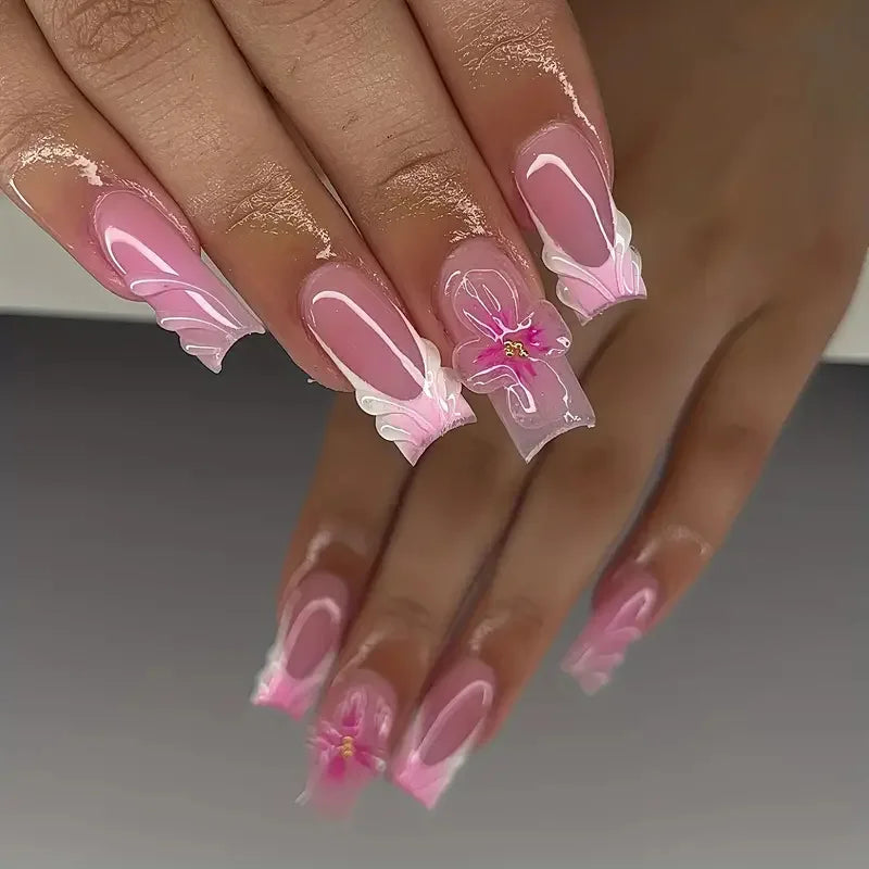 Long decorated nails with raised embellishments shown on hands
