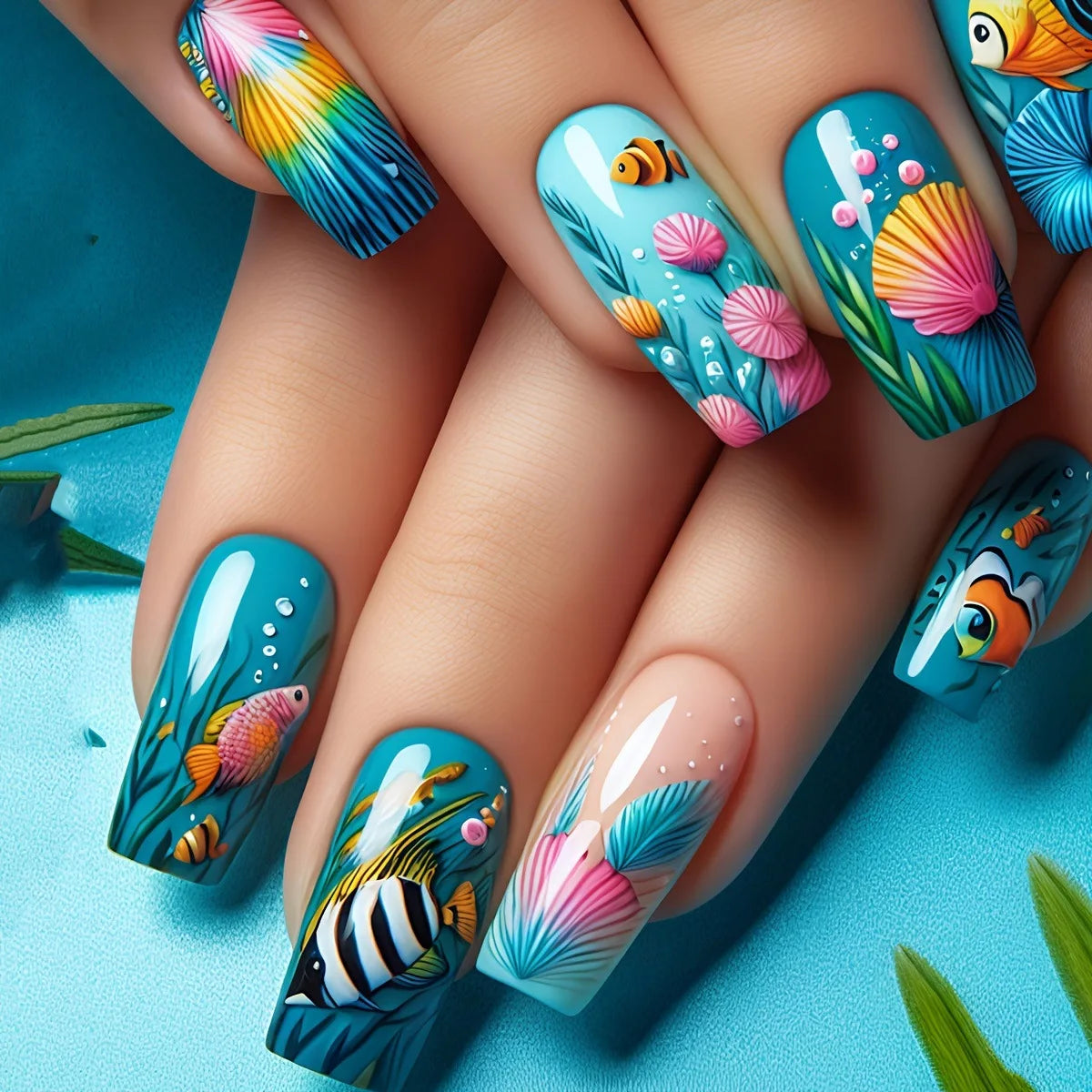 Colorful marine-themed nail artwork shown on hands