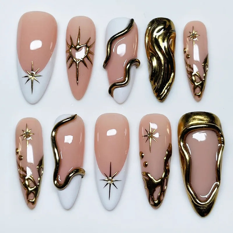 Nude, black and gold press-on nails arranged in rows