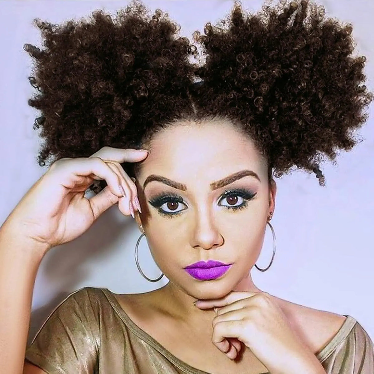 Curly puff hairpiece shown with attachment details or styled on a model