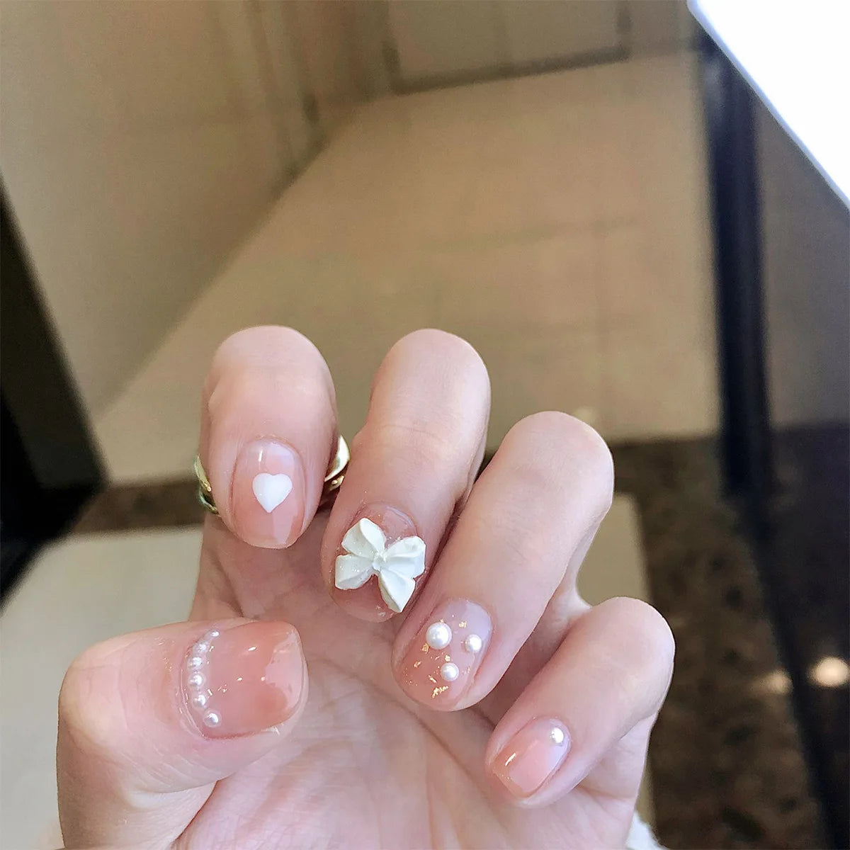 Decorated nail designs shown on hands