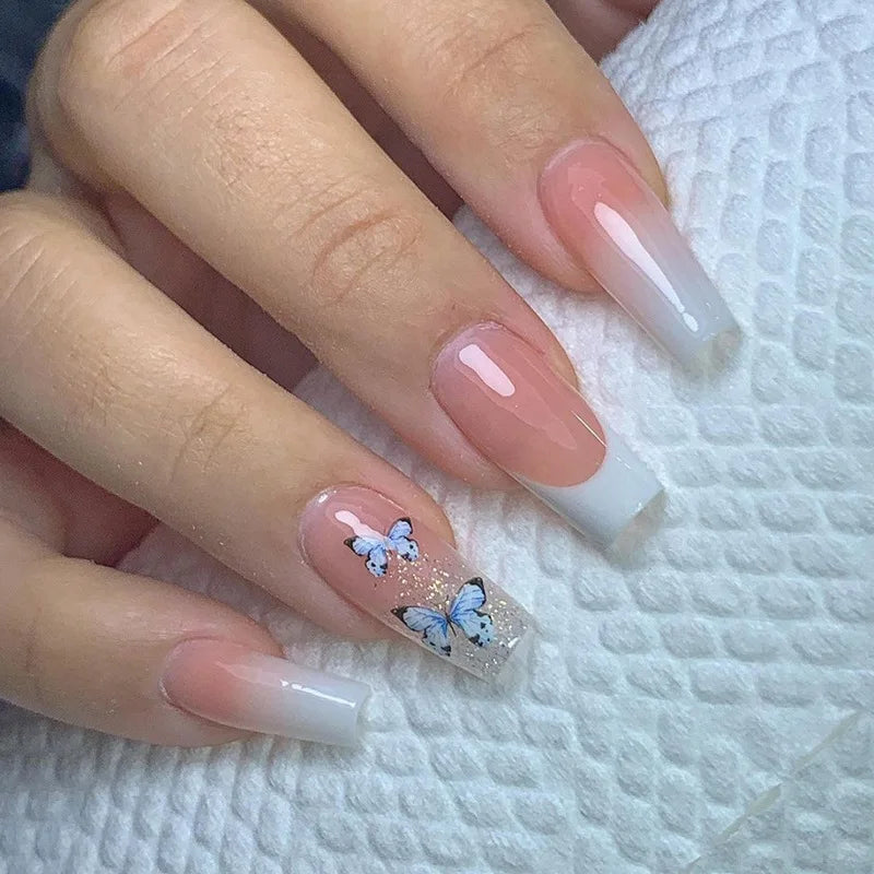 Decorated nail designs shown on hands