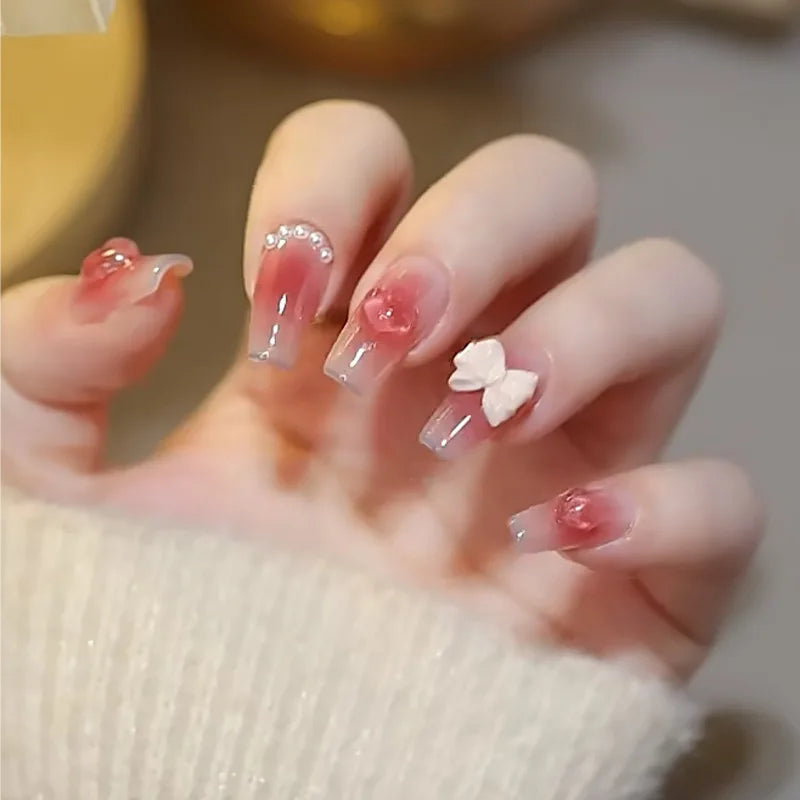 Decorated nail designs shown on hands
