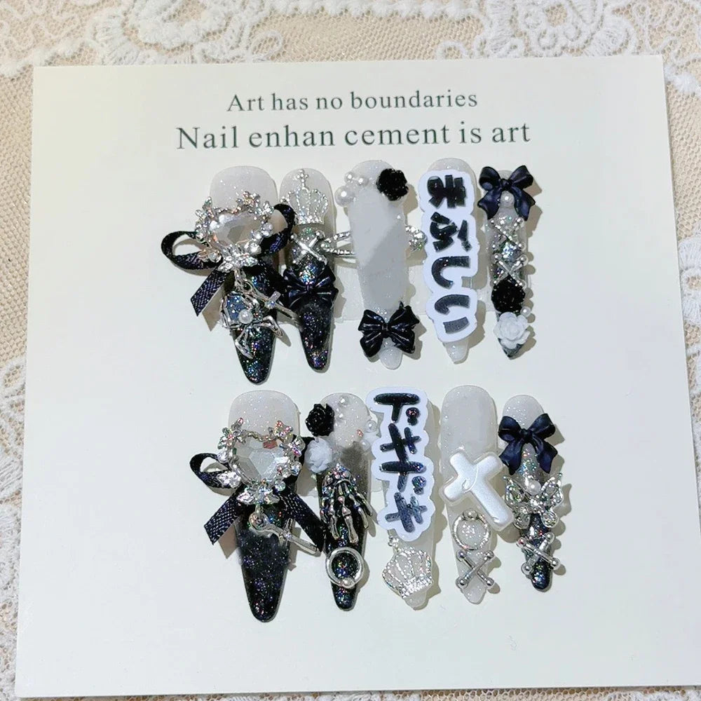 Decorated press-on nail sets with raised embellishments on display cards