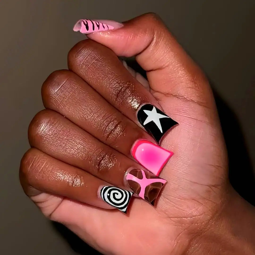Decorative nail designs with raised accents shown on hands