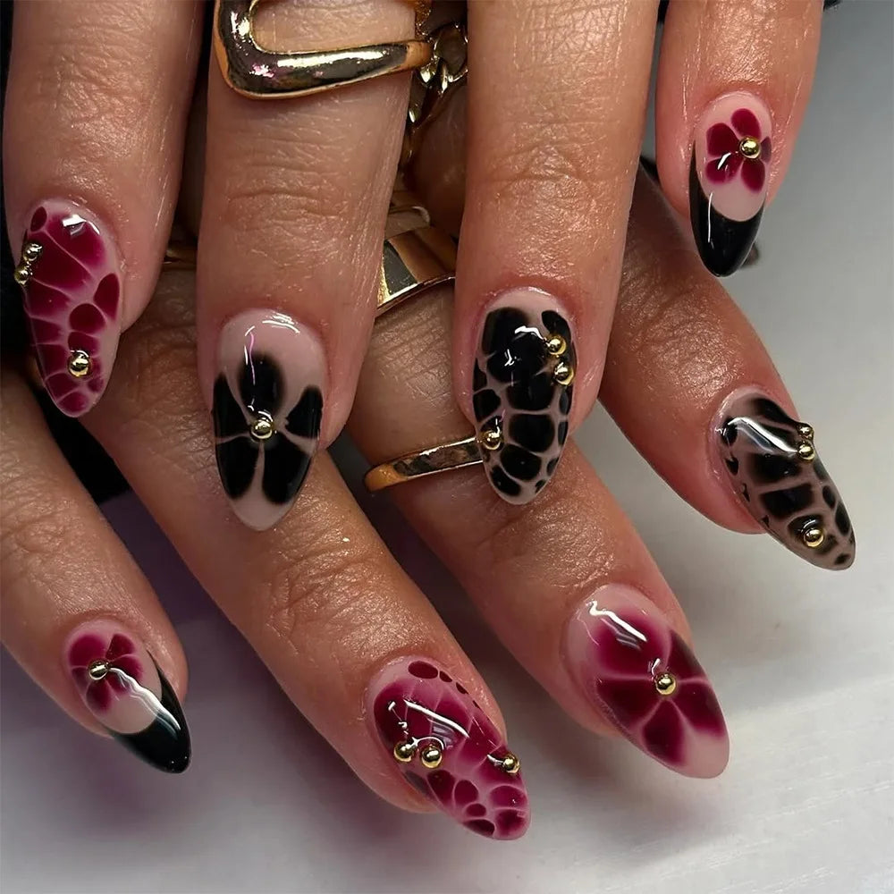 Decorated nail designs shown on hands