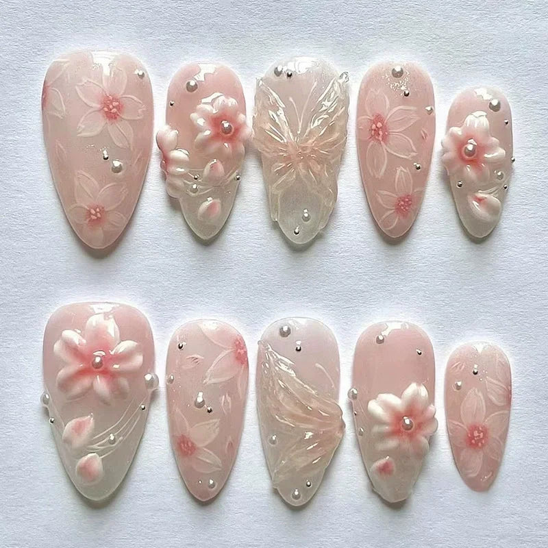 Decorated press-on nails arranged in rows