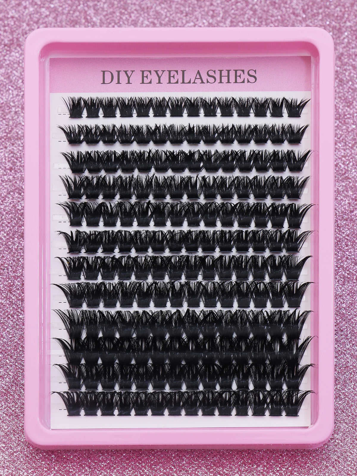 False eyelash clusters arranged in rows in a tray