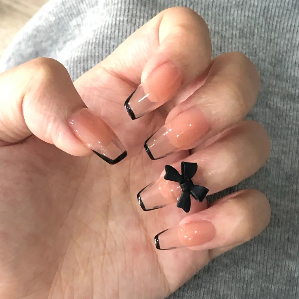 Decorated nail designs shown on hands