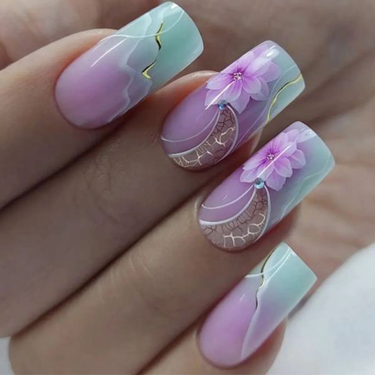 Decorative nail designs shown on hands