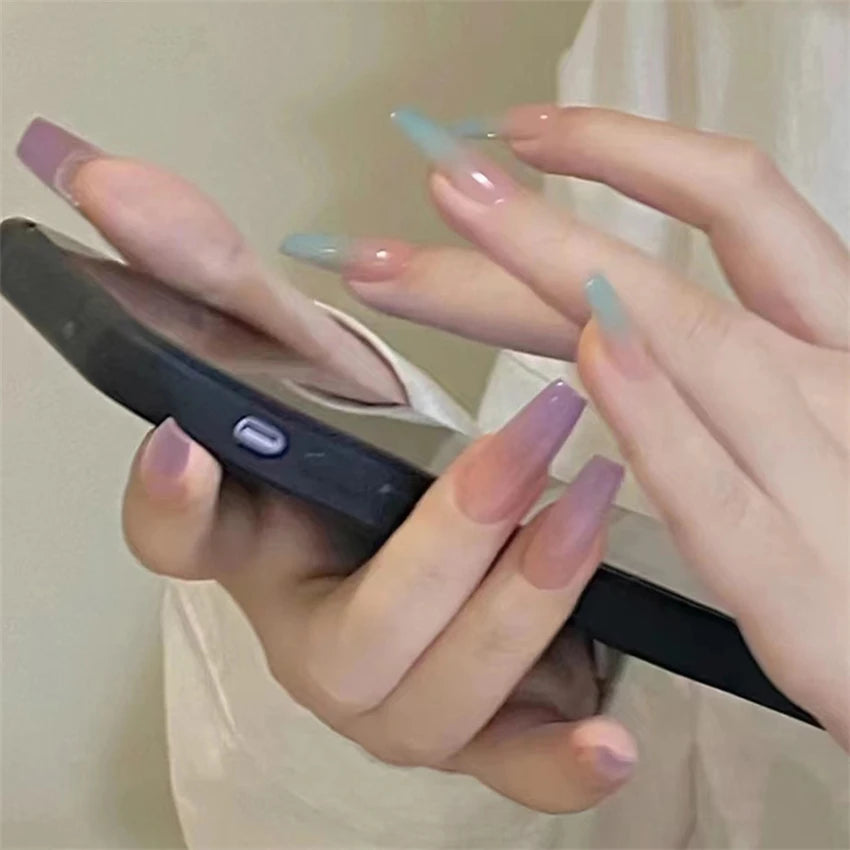 Decorated nail designs shown on hands