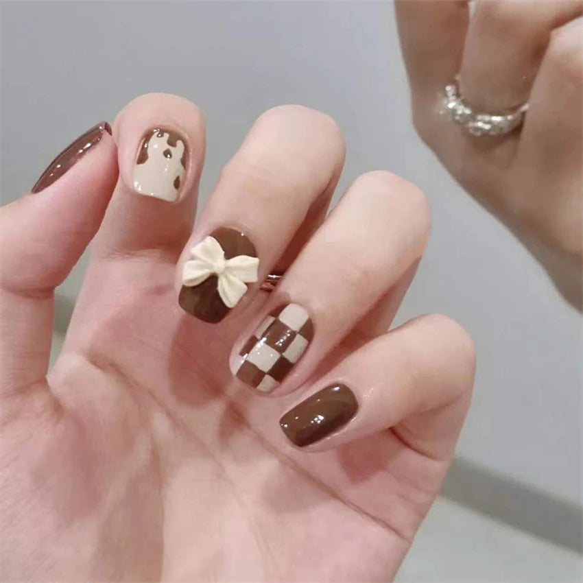 Decorated nail designs shown on hands