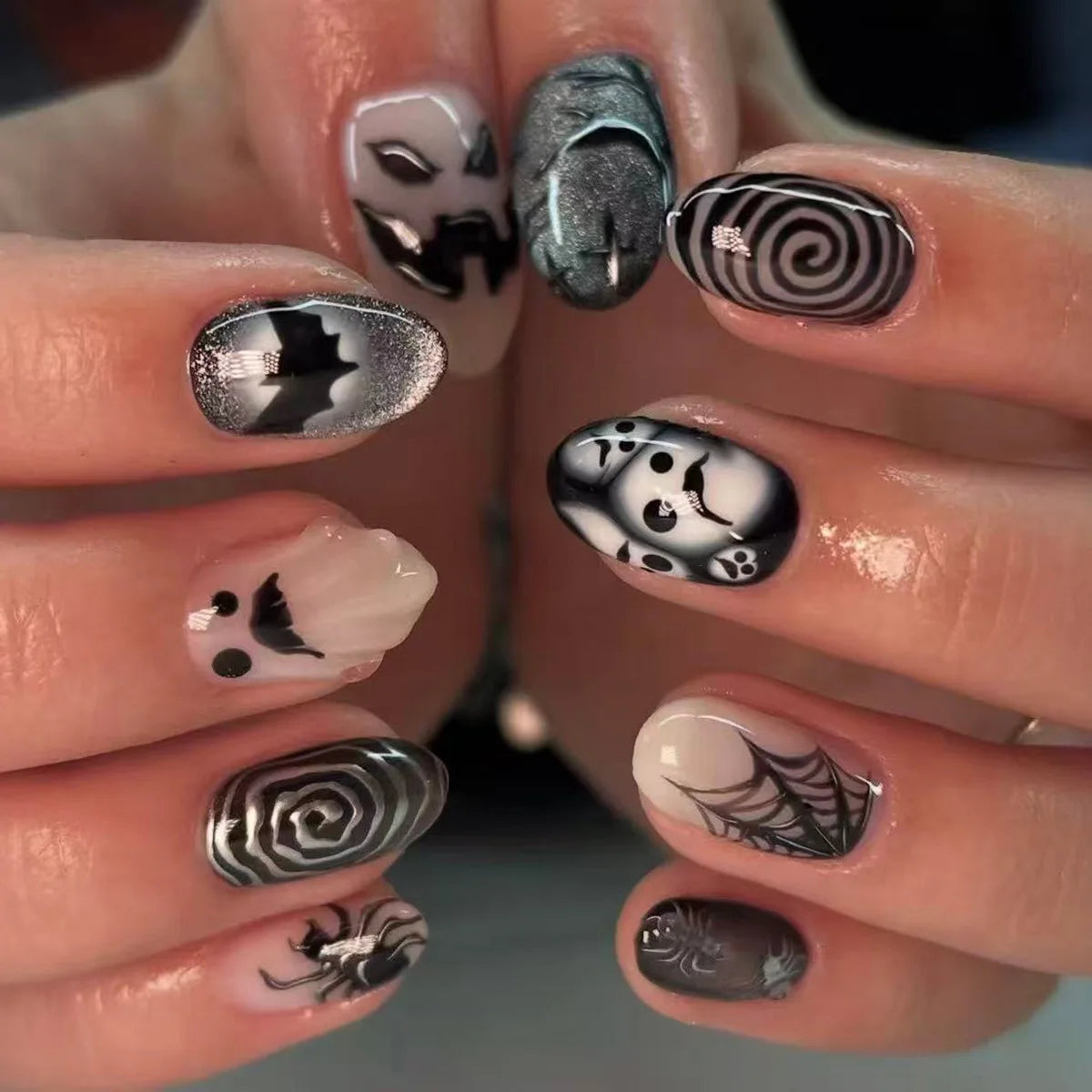Metallic and decorated nail designs shown on hands