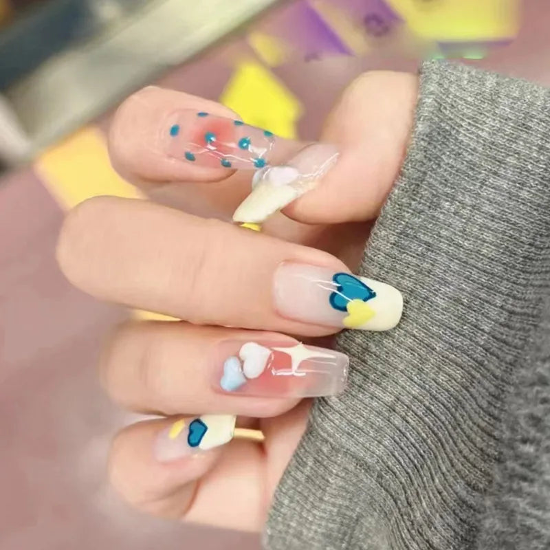 Decorated nail designs shown on hands