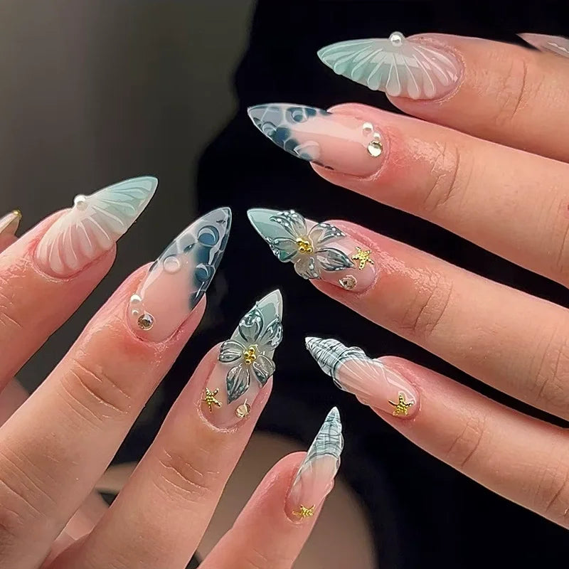 Decorated nail designs shown on hands