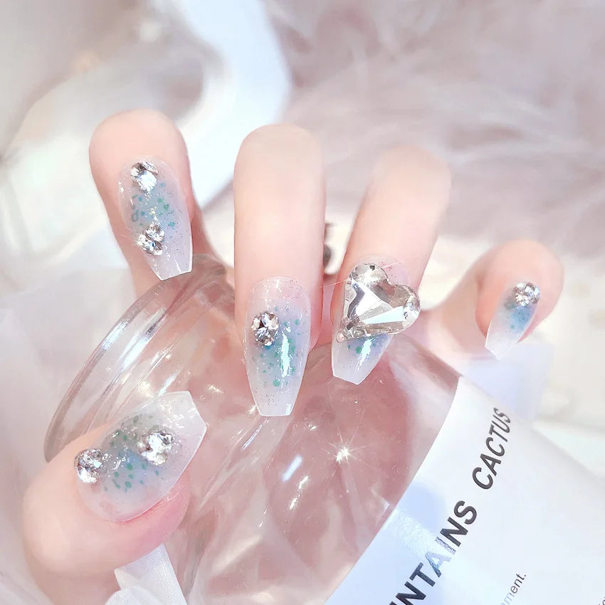 Decorated nail designs shown on hands