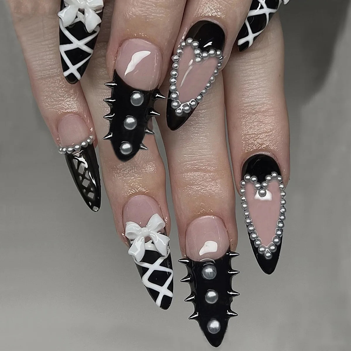 Decorated nail designs shown on hands