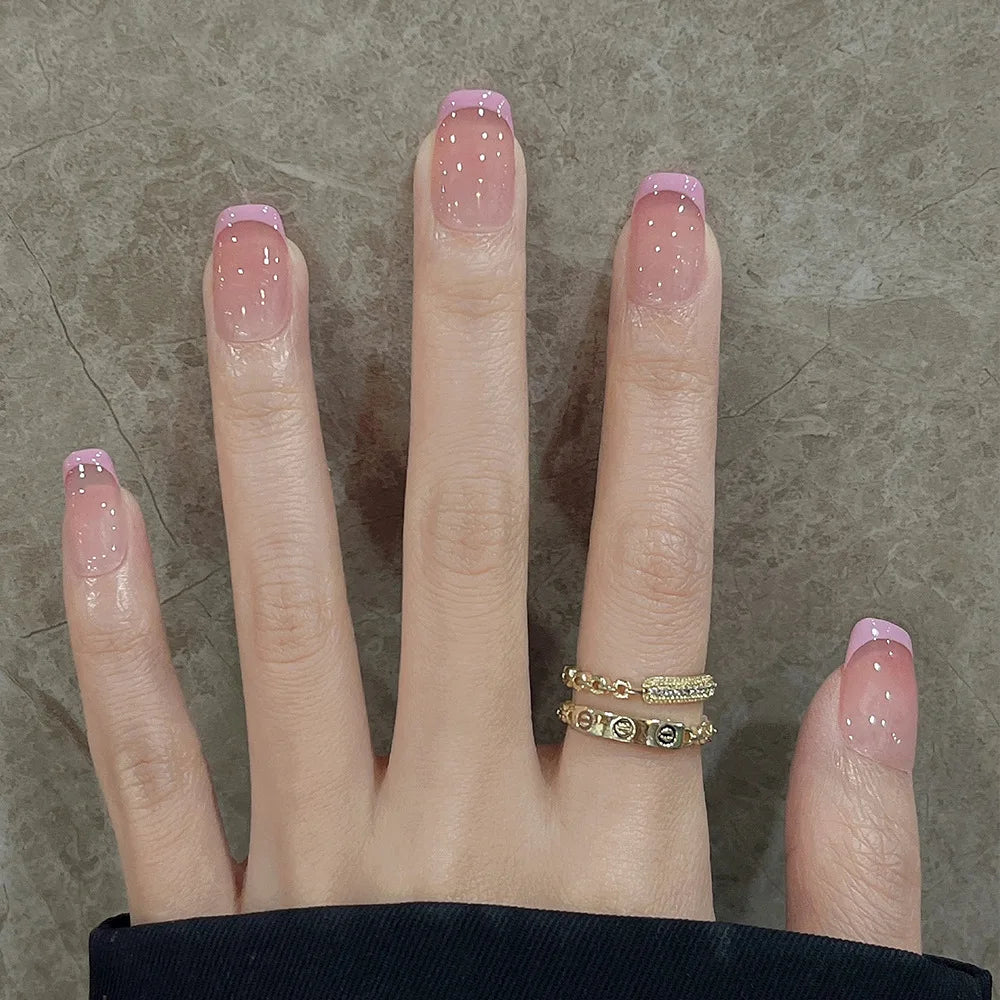 Decorated nail designs shown on hands