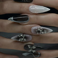 Metallic and decorated nail designs shown on hands
