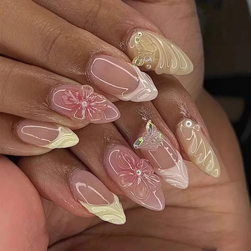 Decorative nail designs with raised accents shown on hands
