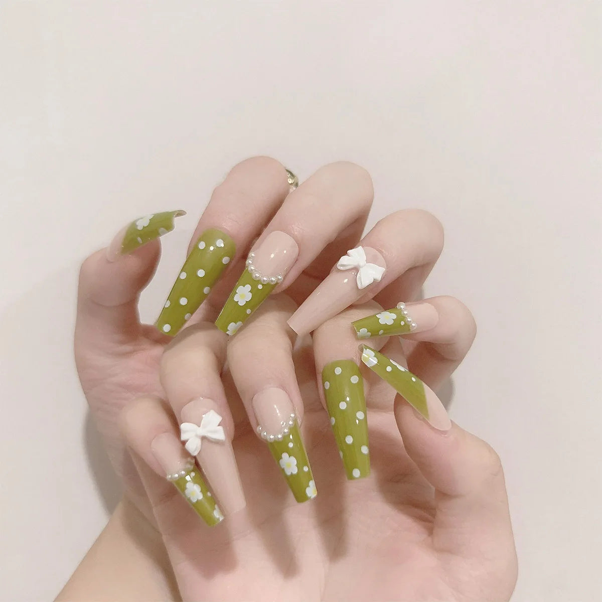 Decorated nail designs shown on hands