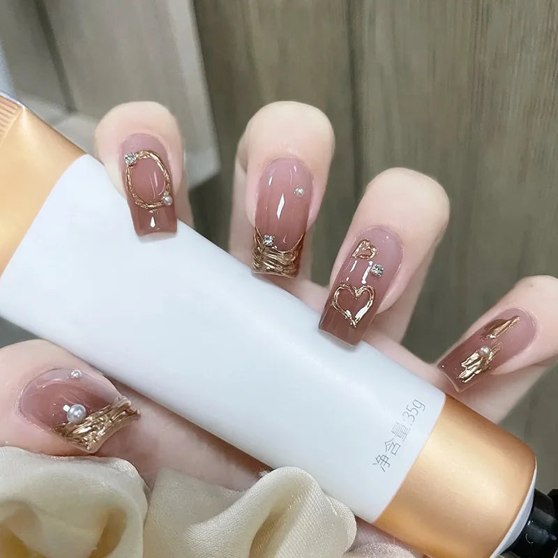 Decorated nail designs shown on hands