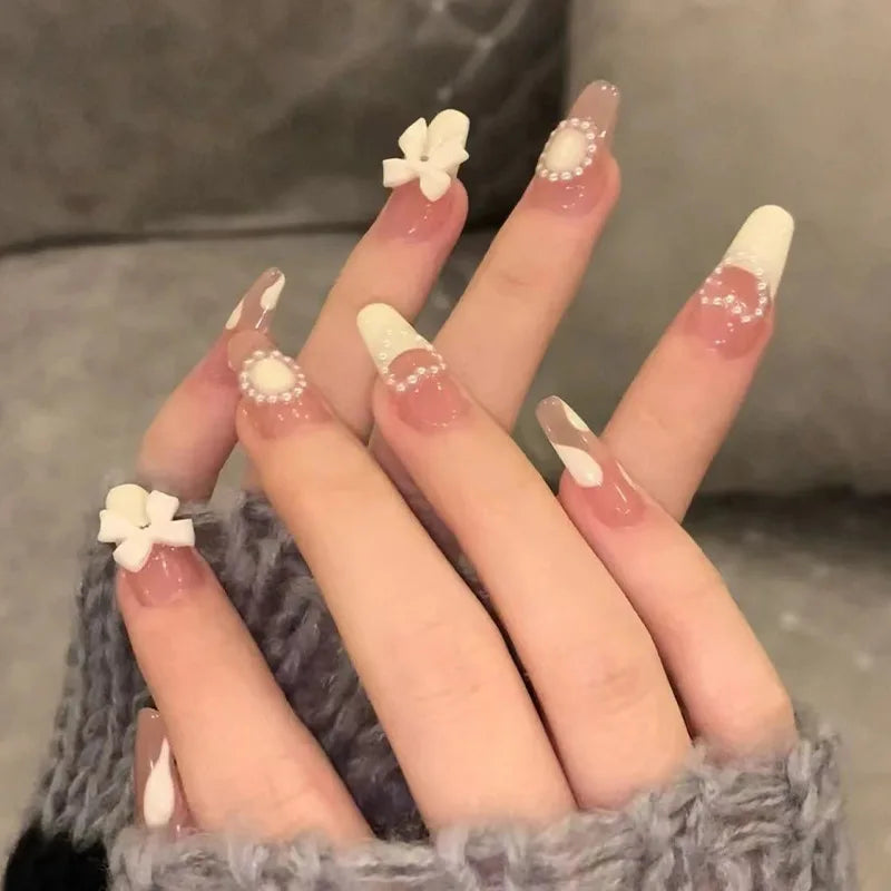 Decorated nail designs shown on hands