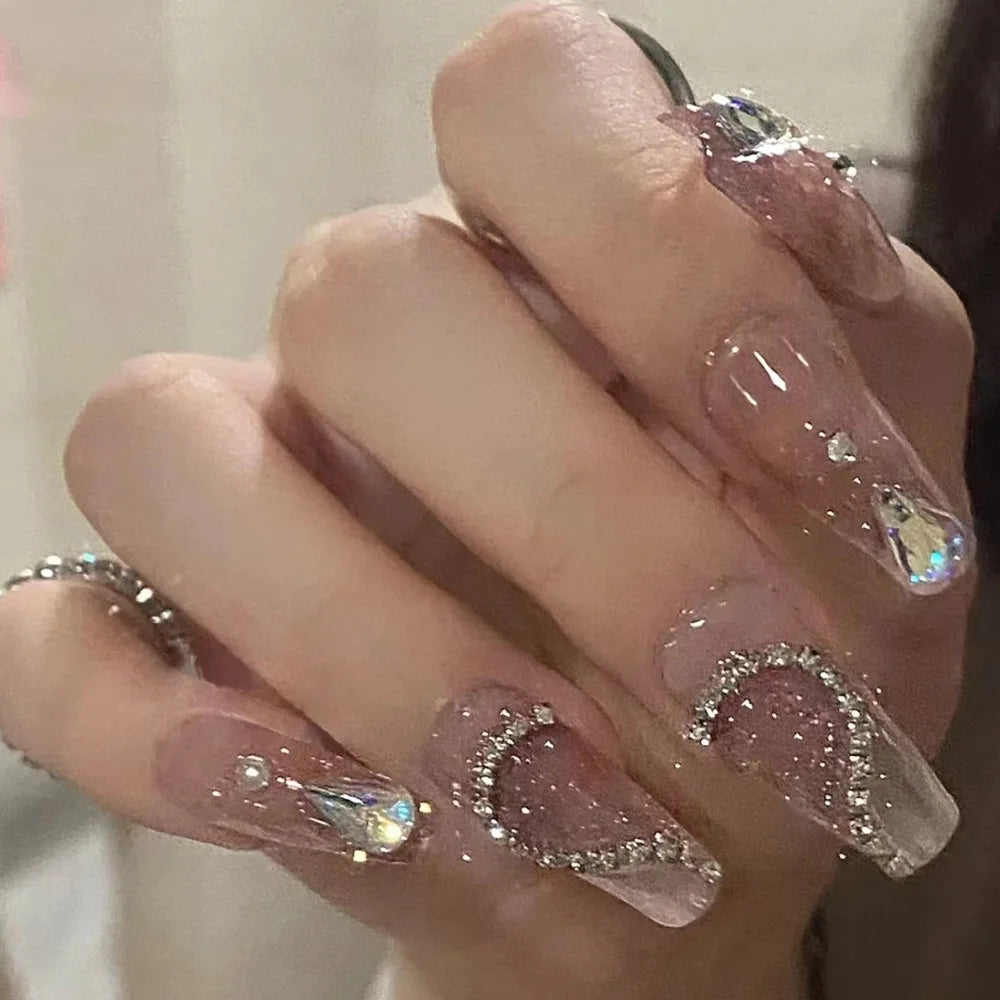 Decorated nail designs shown on hands